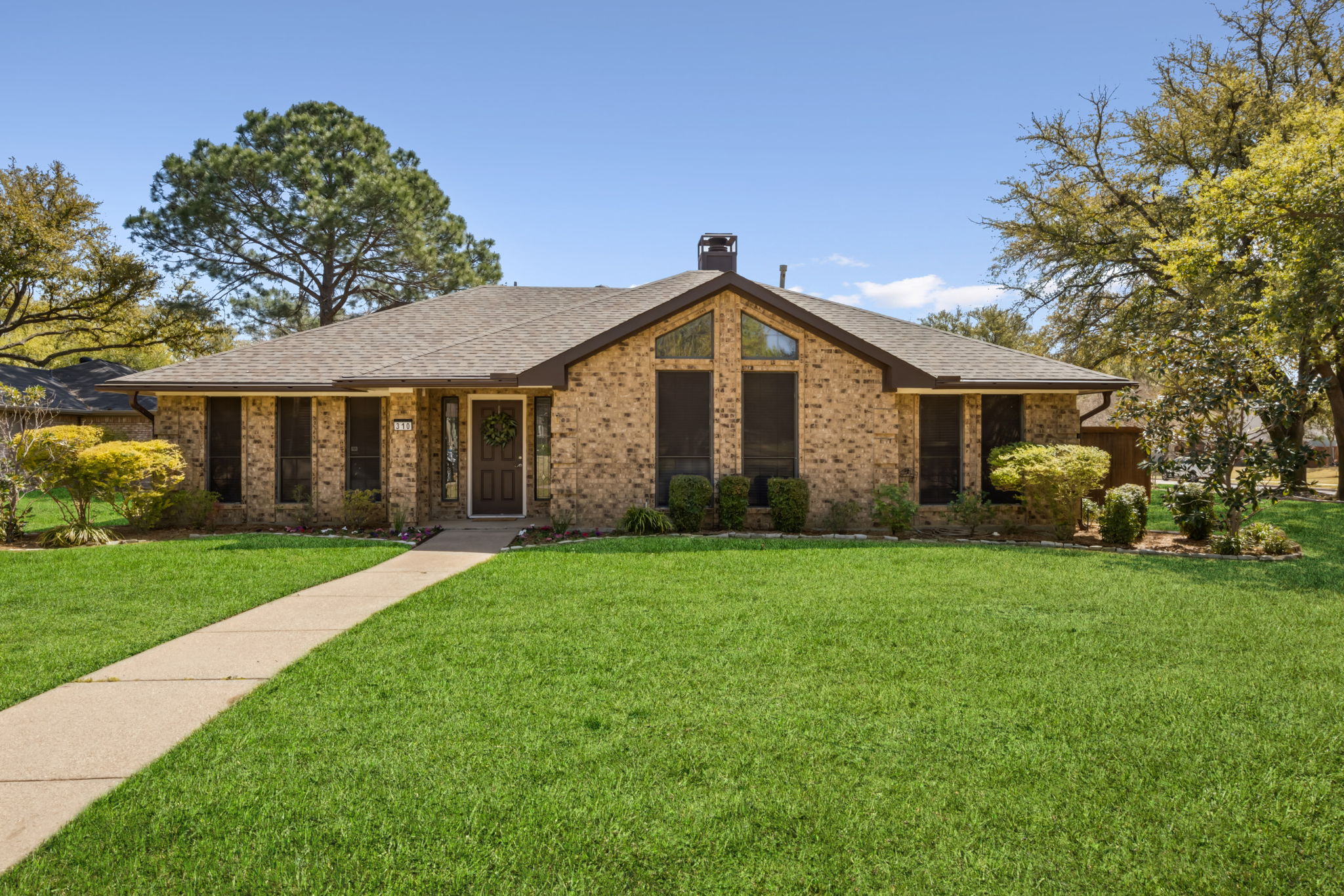 Beautifully Landscaped - Inviting Drive up!