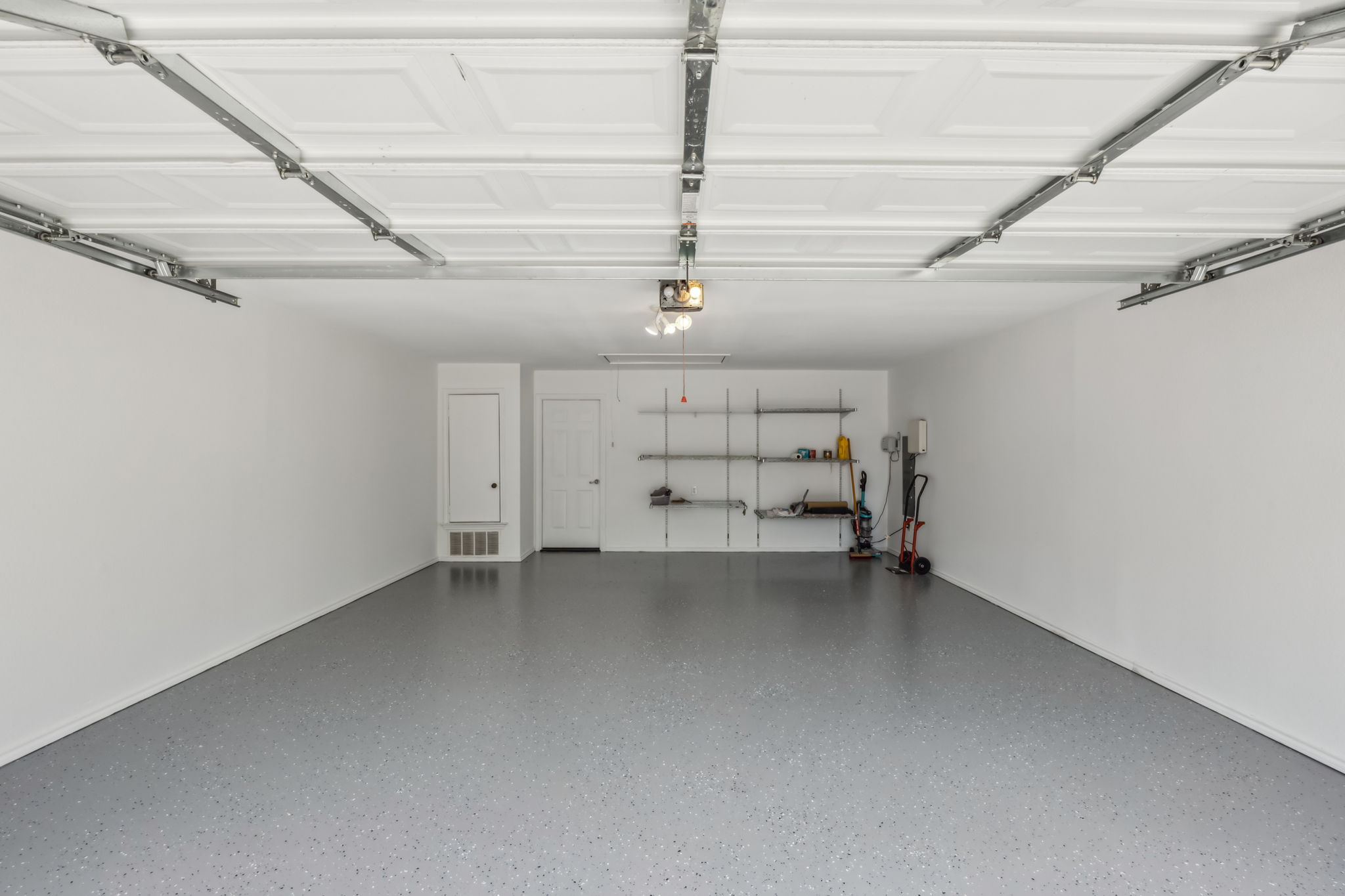 NEW Epoxy flooring has been added to make this garage perfect! (Just a note: NEW Water Heater in March of 2025)