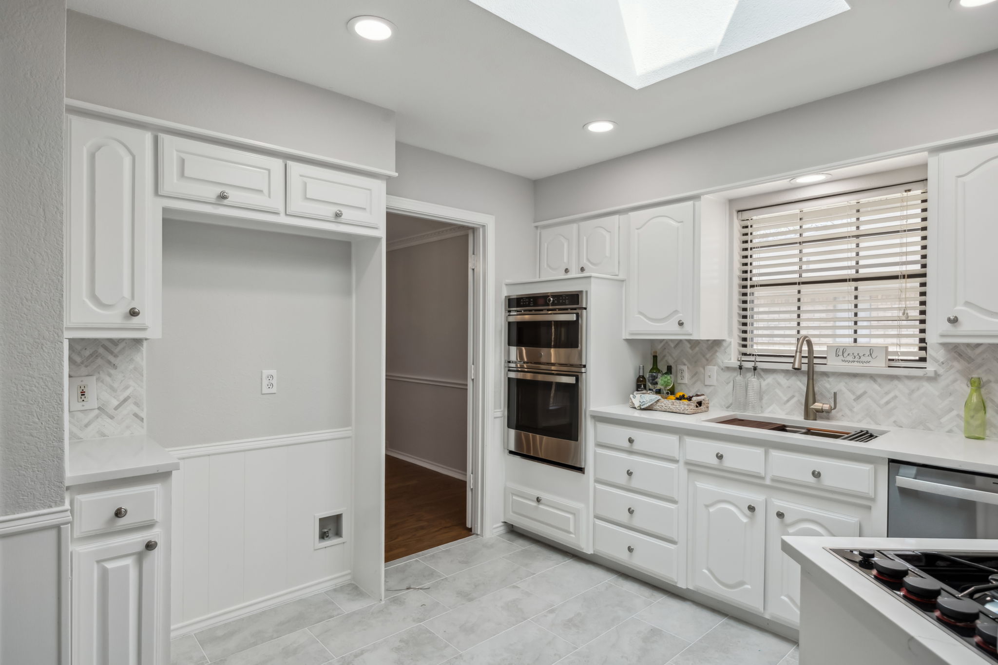 Stylish Backsplash and NEW Oven, Microwave and Dishwasher - Check out the NEW Flooring, too!  And you won't want to miss the High-end Skylight!