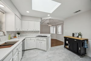 NEWLY Painted Cabinetry - Versatile Island - NEW Quartz Counters - Top of the Line Sink and Faucet AND JennAir Gas Cooktop!