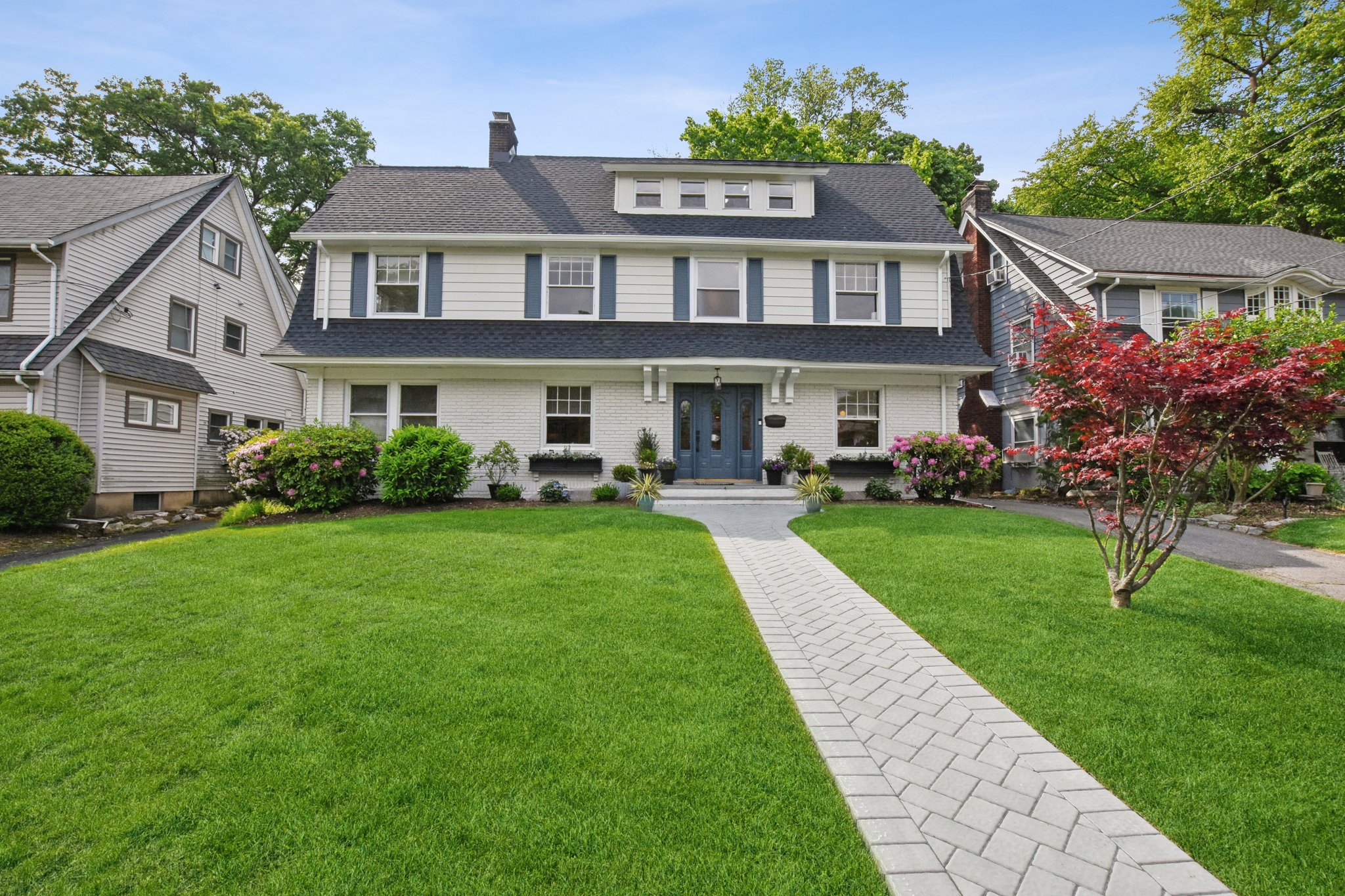 An expansive center hall gem with room for everyone—including a fabulous first-floor living space perfect for Mom, guests, or multigenerational living. And yes, that's a brand new roof.