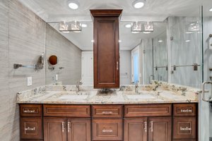 Primary Bathroom with Matching Stone Countertops