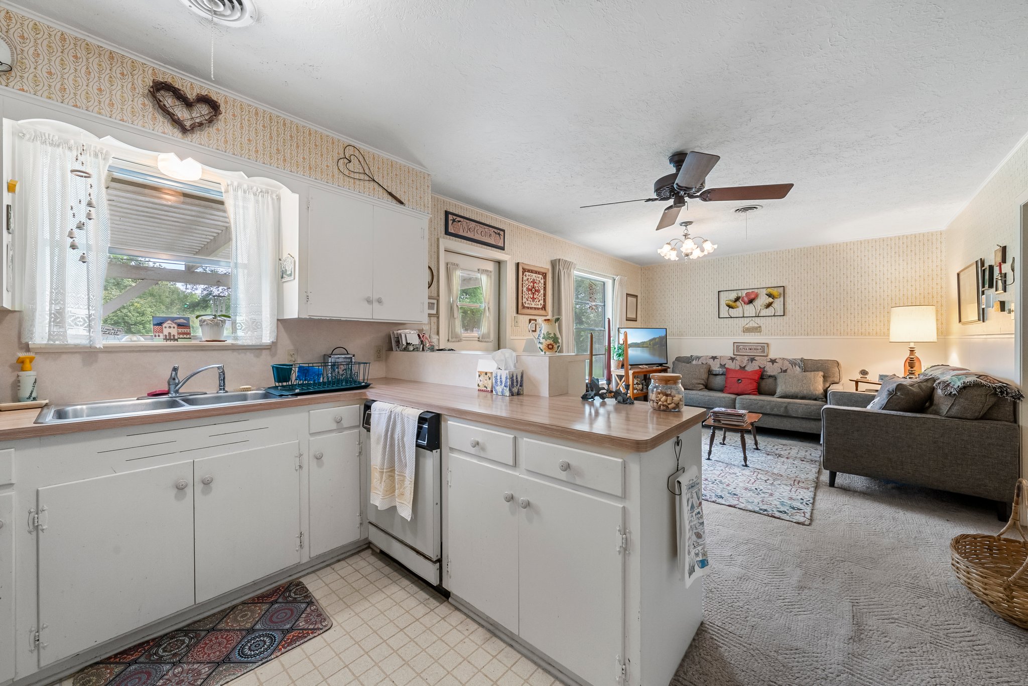 Kitchen is open to the living room at the back of the house.
