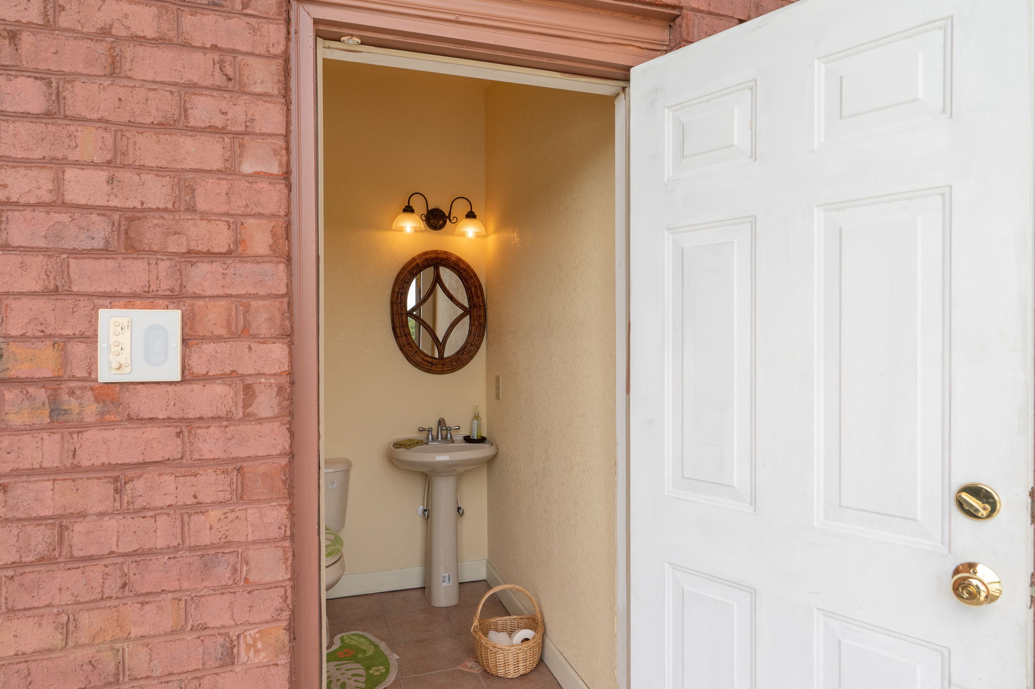 Outside porch has two ceiling fans and an outside full bathroom.