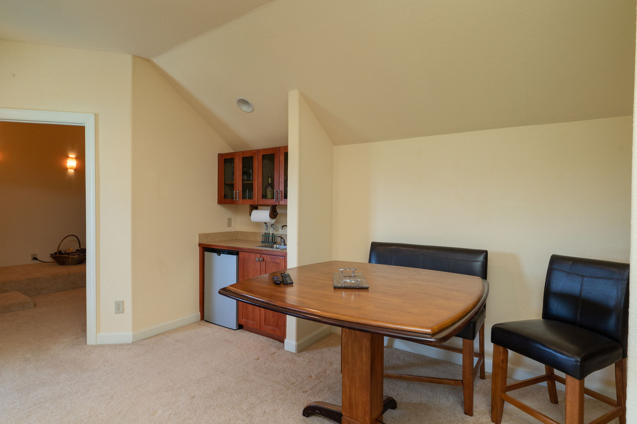 Upstairs has three rooms, the main area has a wet bar.
