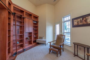 Well appointed library greets visitors at the front door.  Watch the kids swim as you work from home.