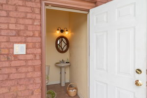 Outside porch has two ceiling fans and an outside full bathroom.