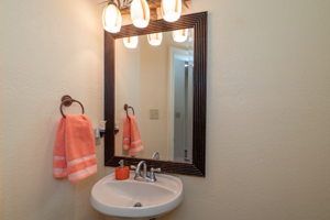 Half bathroom in the hallway near dining room and kitchen.