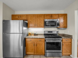 Kitchen with refrigerator and range/microwave