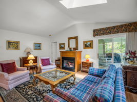 Living with fireplace and covered deck