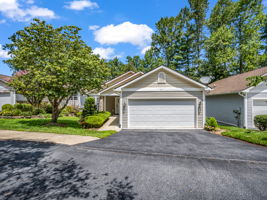 Front with garage and road