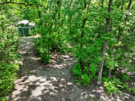 The lot has a gravel circle drive that is easy to navigate.