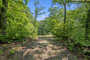 The parcel has a gravel driveway and an impressive existing 30x40 steel outbuilding.