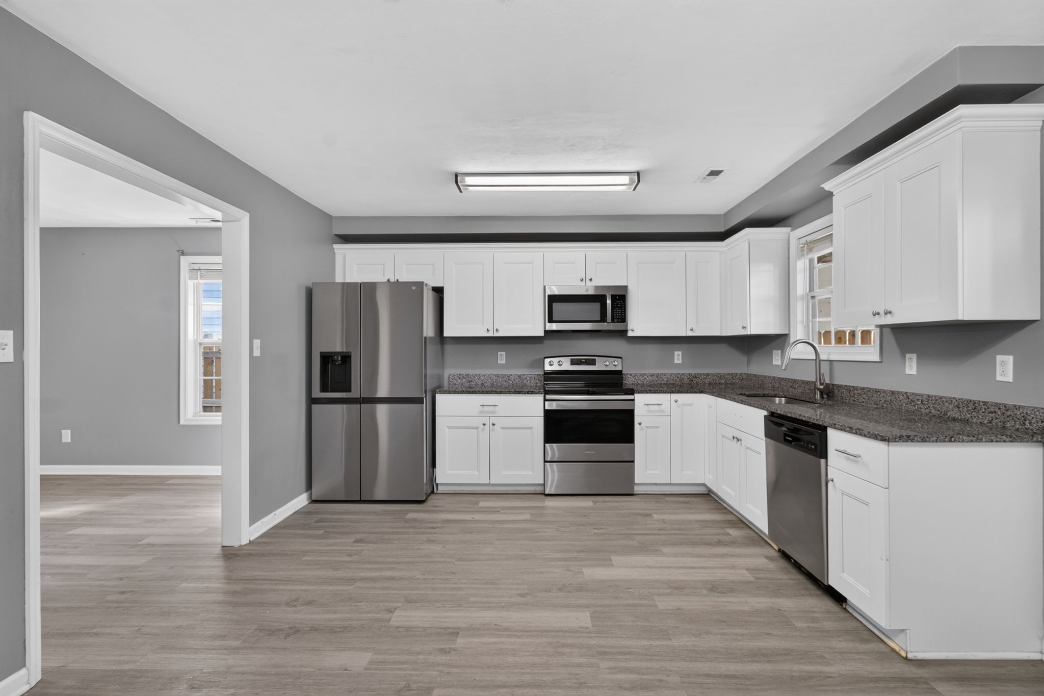 stainless appliances, white cabinetry
