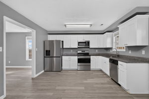 stainless appliances, white cabinetry