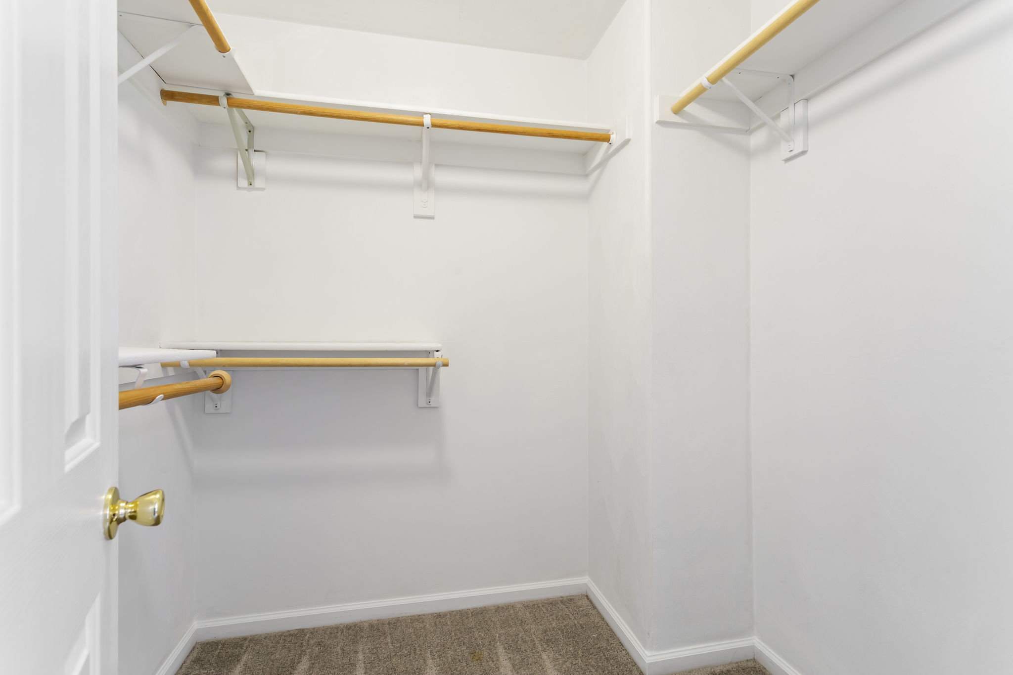 Full-size Primary Bedroom Walk-in Closet.