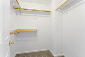 Full-size Primary Bedroom Walk-in Closet.