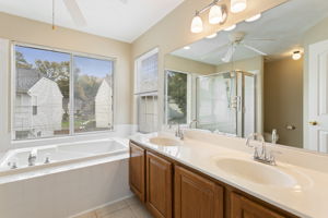 Private bath with dual vanities.