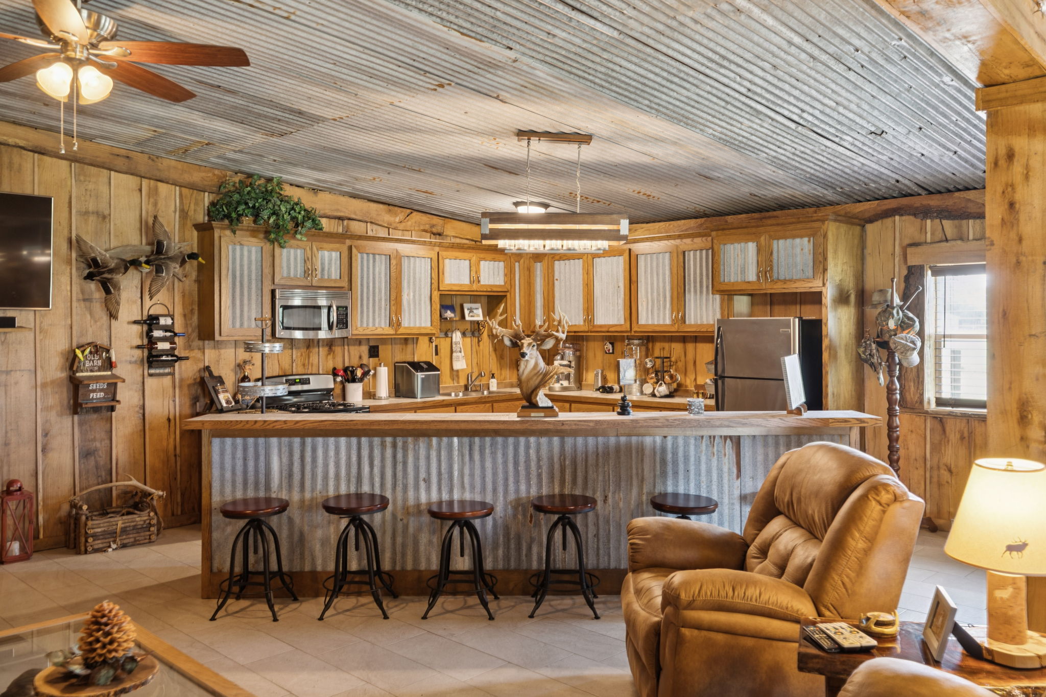 Full kitchen with stainless steel appliances.