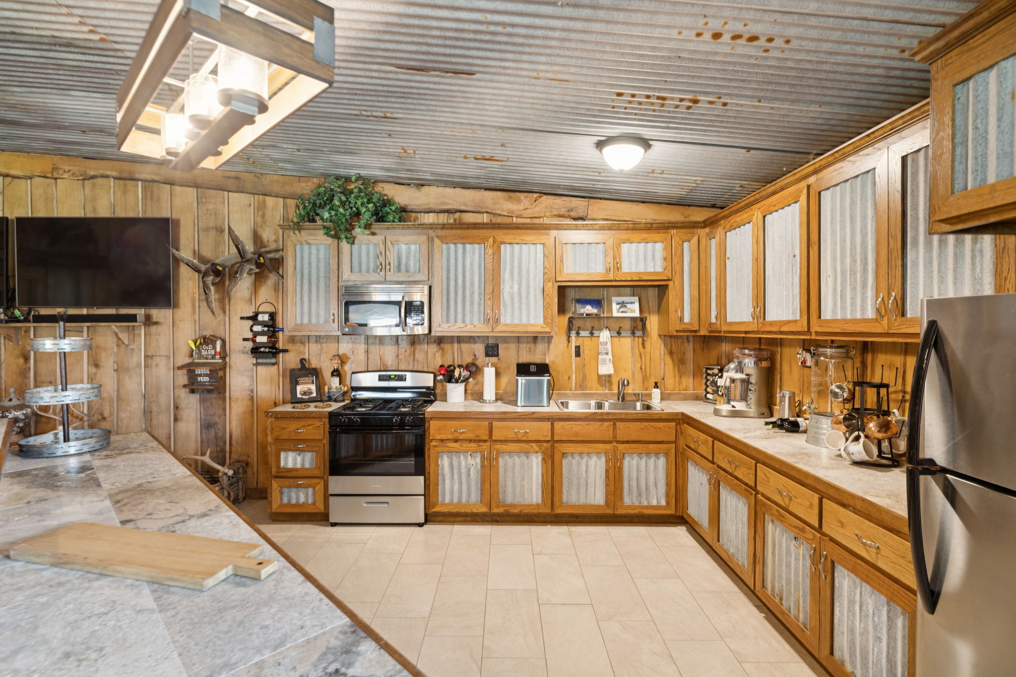 Full kitchen with stainless steel appliances.