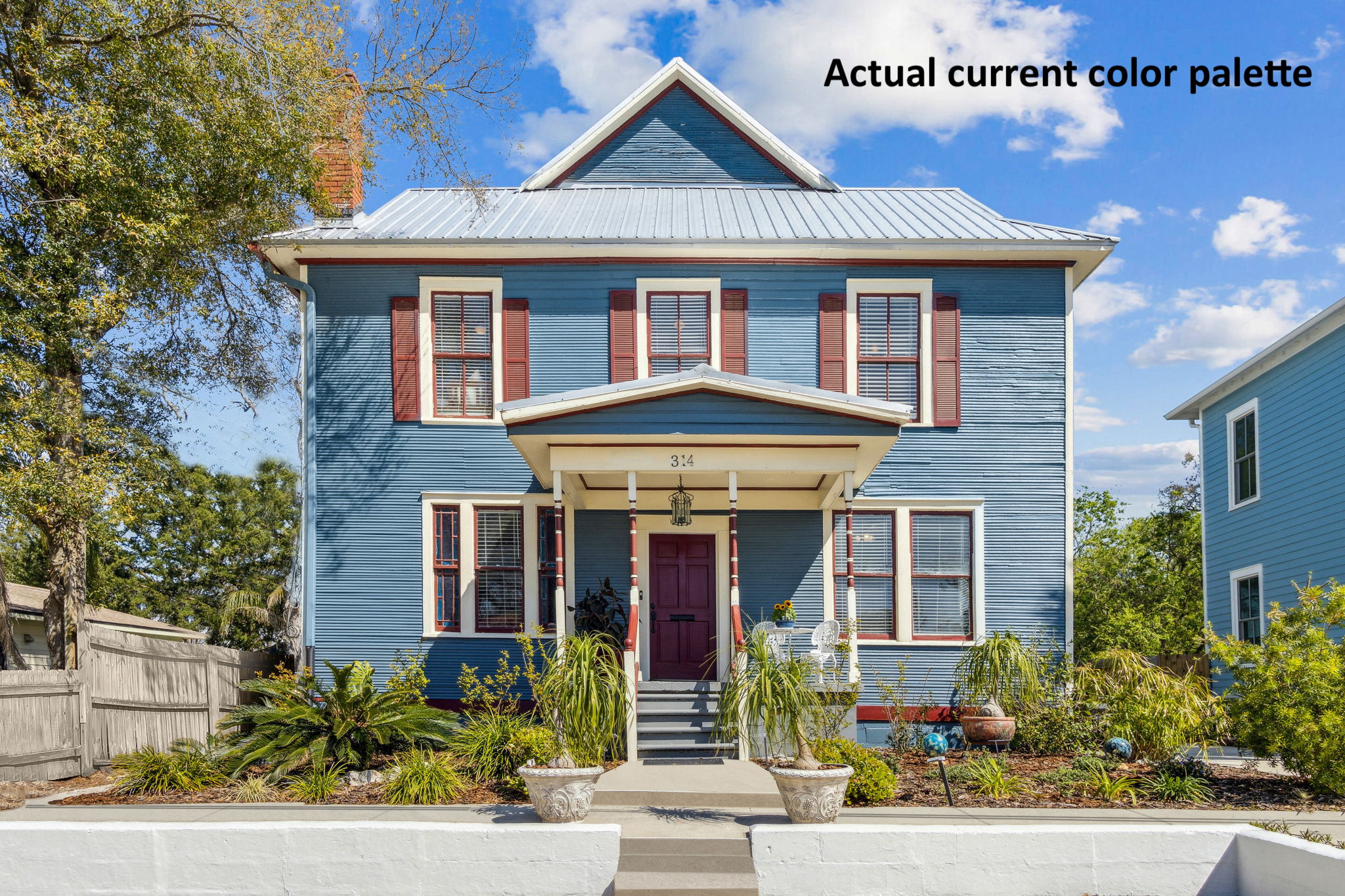 ...with original decorative milled wood siding, and turned balustrade porch!
