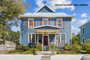 ...with original decorative milled wood siding, and turned balustrade porch!