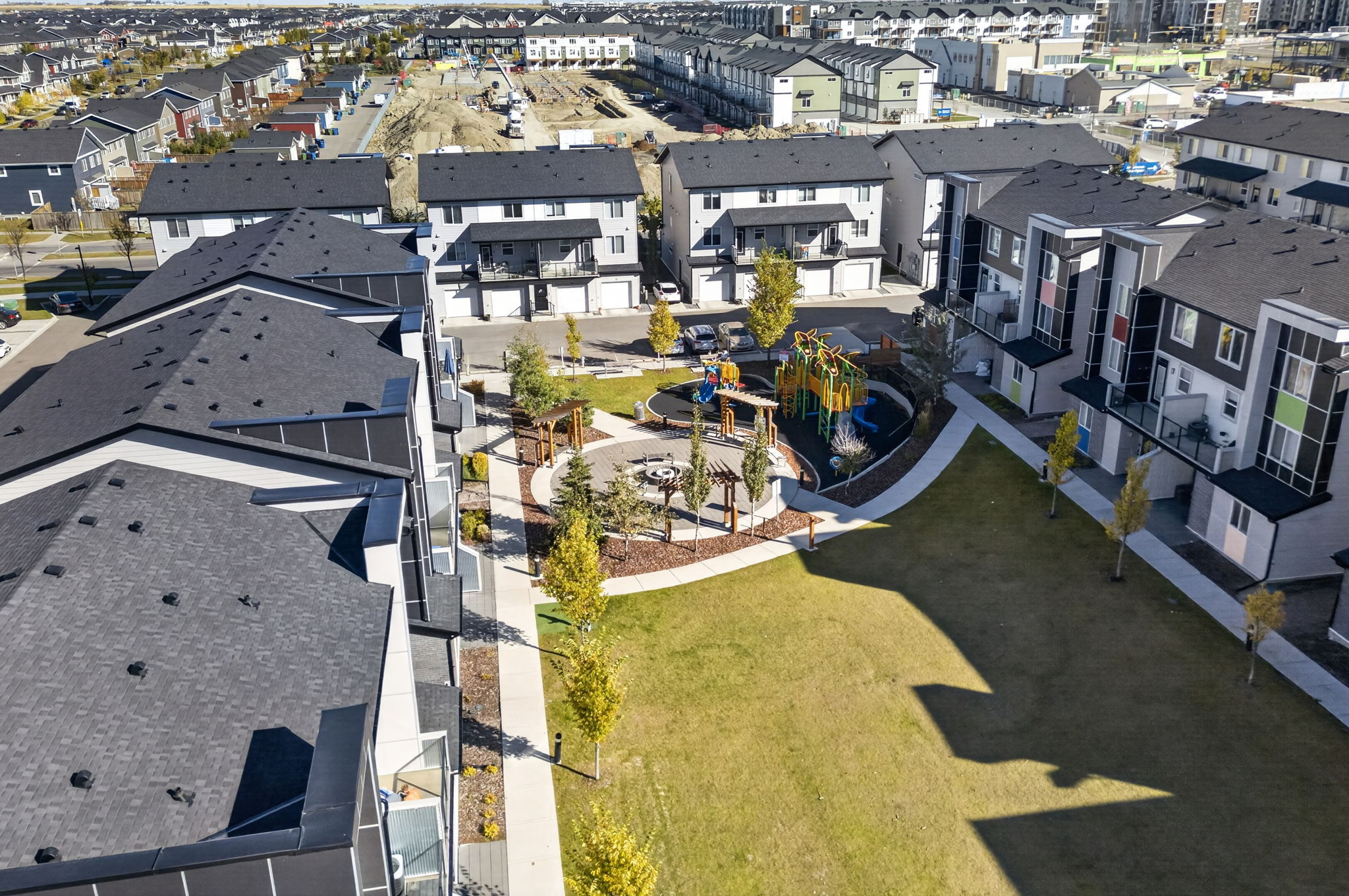 Shared courtyard with playground, firepit and BBQ area