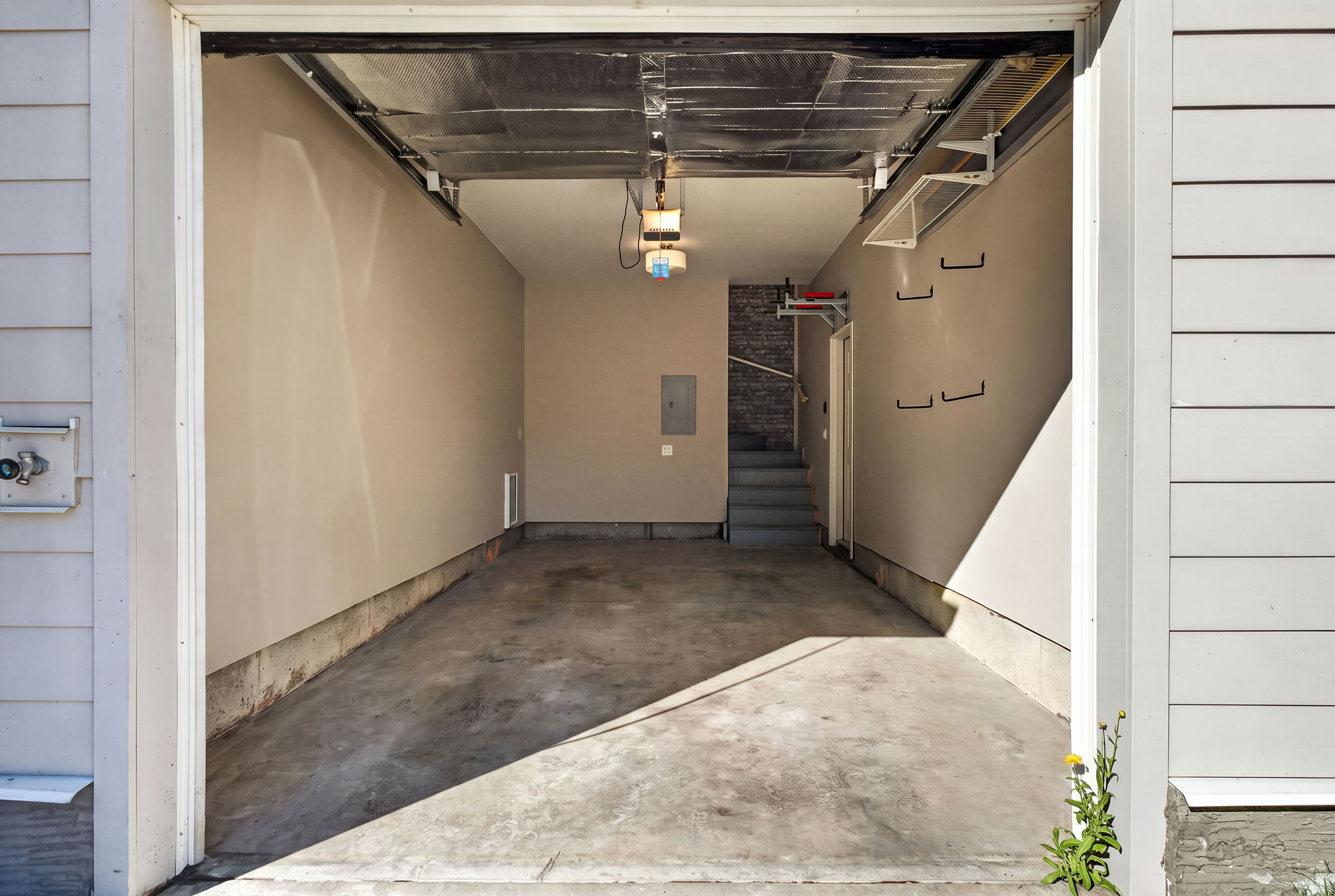 Oversized heated garage with about six extra feet