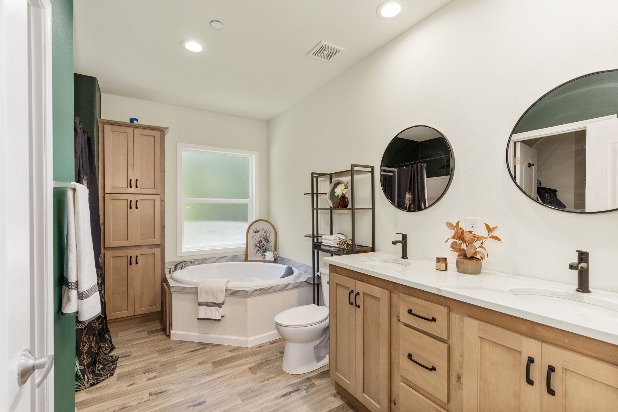 Primary bath with shower and huge soaking tub.