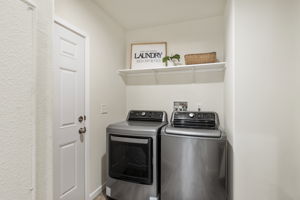 Laundry and door to backyard.