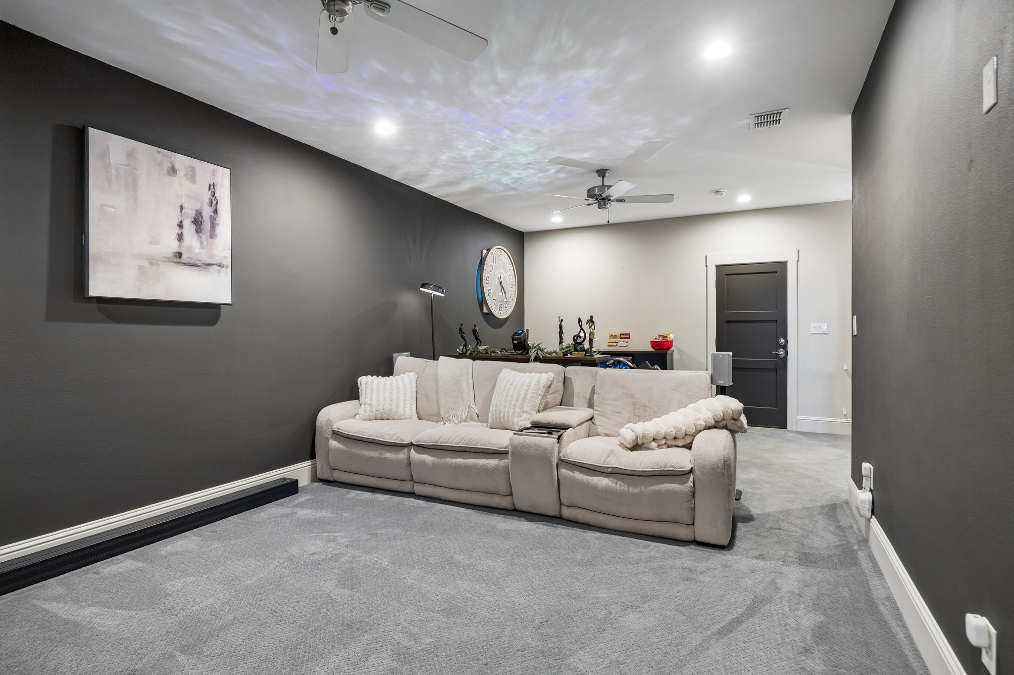 A Flexible Upstairs Retreat – Beyond its theater setup, the spacious media room offers enough square footage for multiple seating arrangements, gaming equipment, or additional entertainment features.