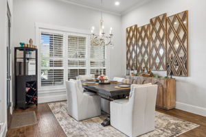 A Bright Dining Space with Backyard Views – Large windows fill the breakfast area with natural light and offer a relaxing view of the outdoor living spaces, creating an inviting setting for casual meals and conversation.