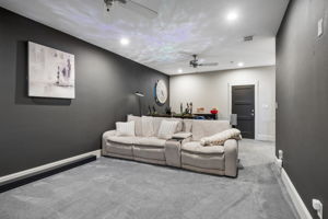 A Flexible Upstairs Retreat – Beyond its theater setup, the spacious media room offers enough square footage for multiple seating arrangements, gaming equipment, or additional entertainment features.