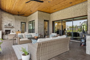 A True Extension of the Great Room – The covered terrace is wide enough for multiple seating zones and connects directly to the interior through the large glass opening, making indoor-outdoor gatherings feel seamless.