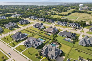 The Renaissance with Lake Ray Hubbard Beyond – The neighborhood’s spacious homesites, custom residences, and nearby lake setting create a distinctive Heath backdrop for this property.
