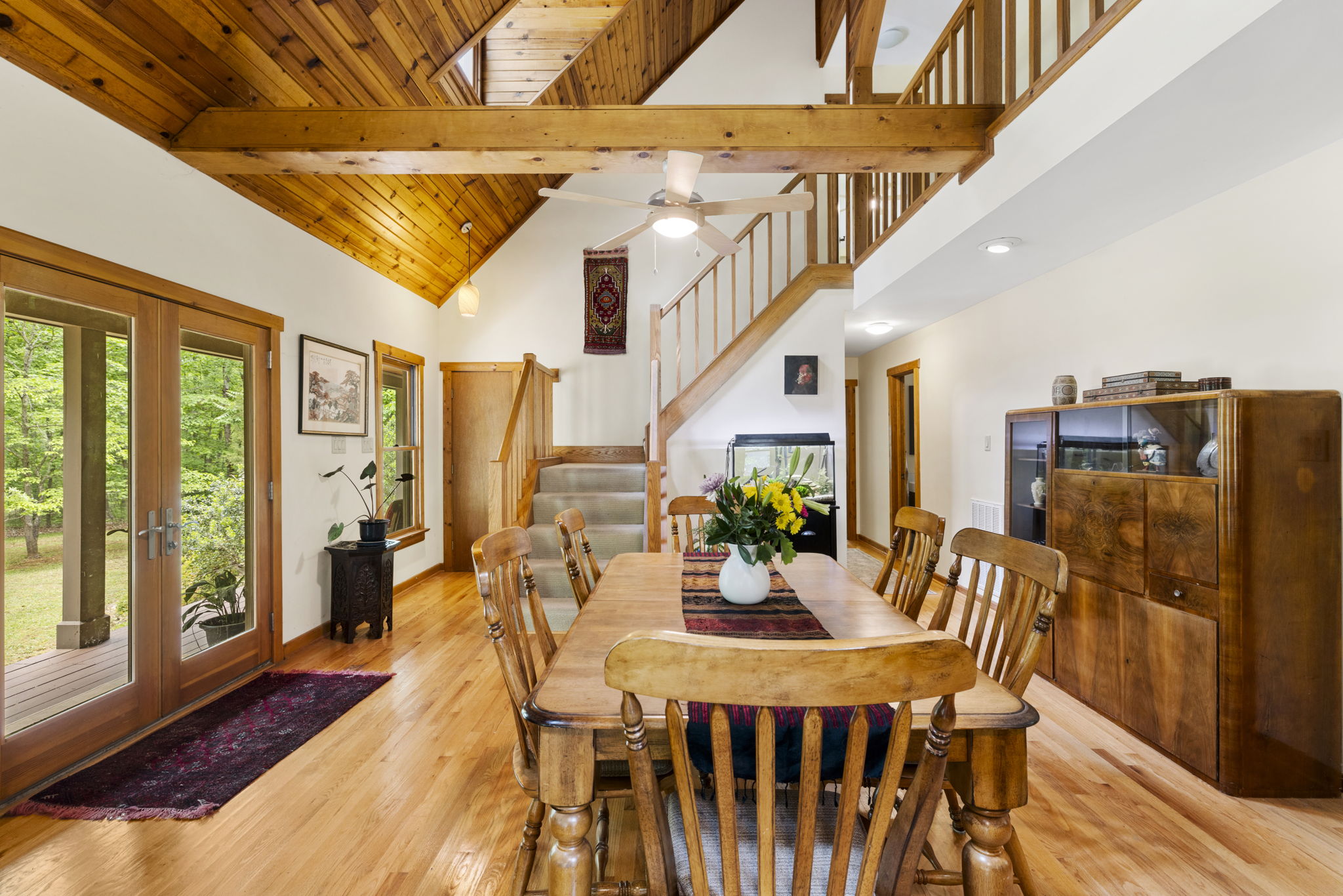 The great room has a flexible layout allowing for multiple uses with space for a large dining area with stairs to the second floor loft area & primary suite.