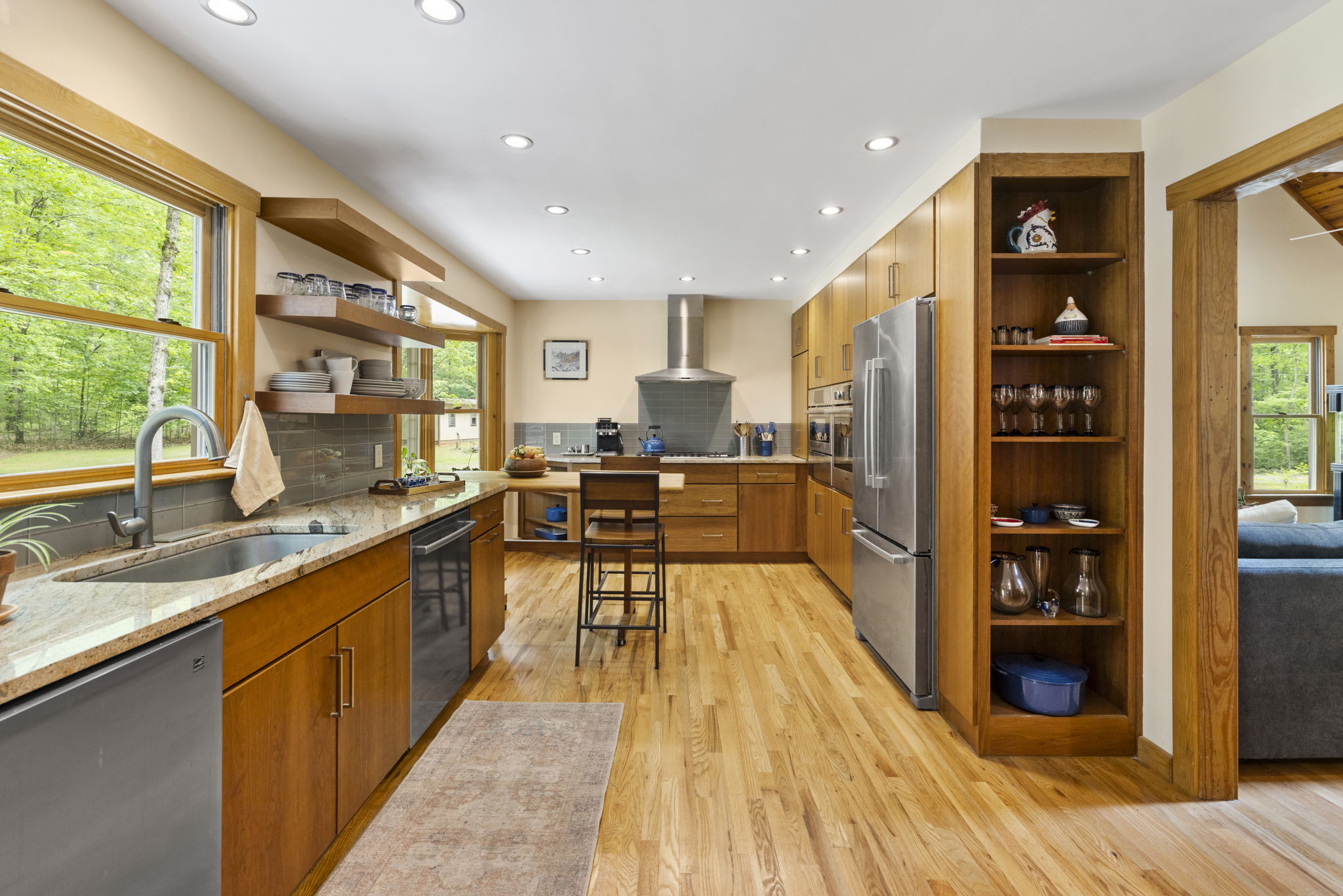 Excellent storage options throughout the kitchen with creative corner cabinet & shelf storage as well as end cabinet nooks.