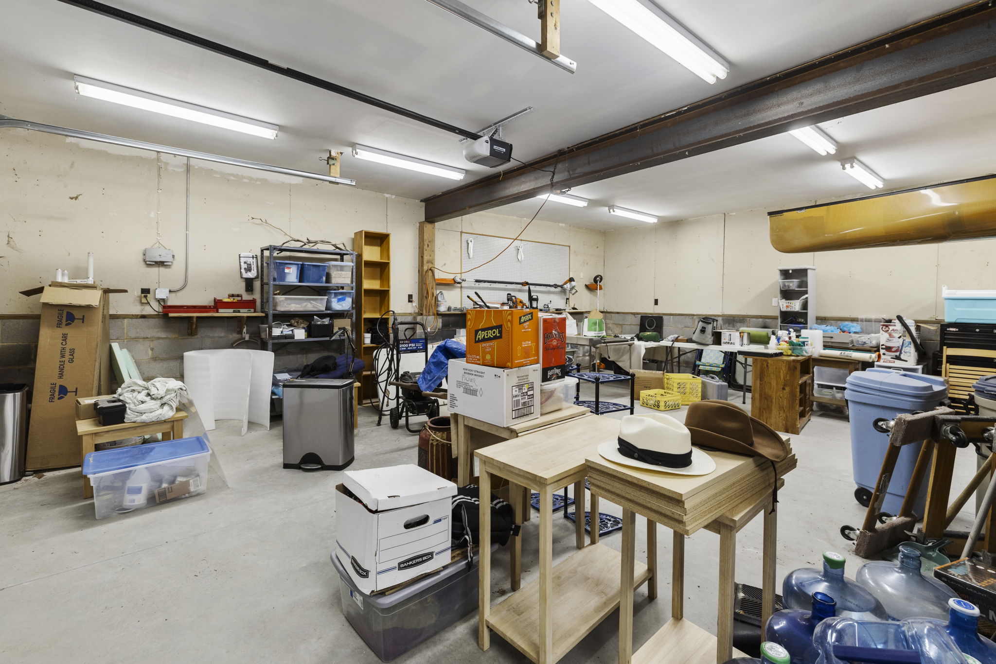 With a massive detached garage this is a dream workshop or mechanic type space with extra tall garage doors (91" clearance). New sump pump installed in garage in 2025.