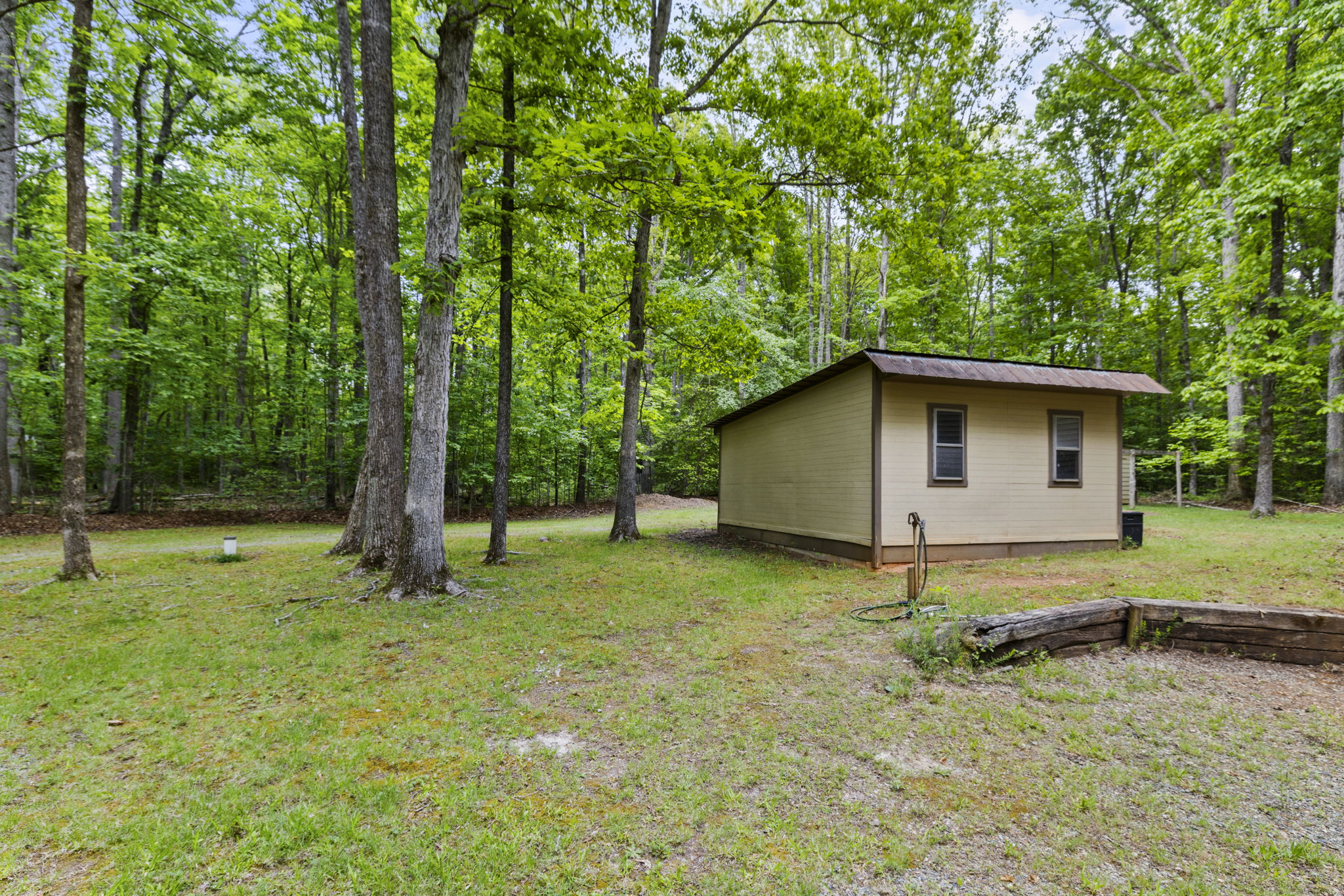 One of several detached storage buildings on the property.