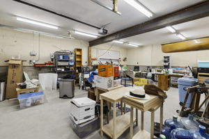 With a massive detached garage this is a dream workshop or mechanic type space with extra tall garage doors (91" clearance). New sump pump installed in garage in 2025.