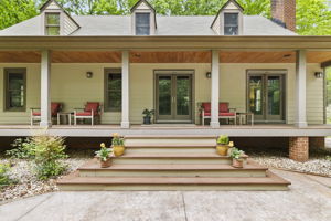 Enjoy the peace and quiet on the full covered country front porch.
