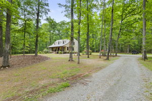 Massive front yard with gravel drive way and plenty of parking.