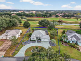 Aerial Front Elevation with Property Lines and Water and Golf Front Views