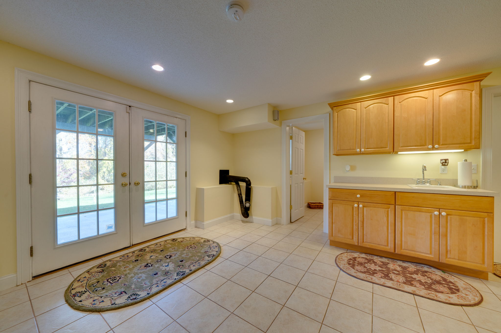 Lower Level Entrance, Partial Kitchen Area