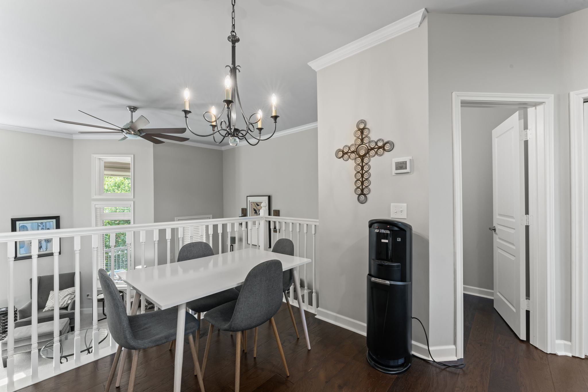 Dining area overlooks the family room and all the natural beauty from the large windows.