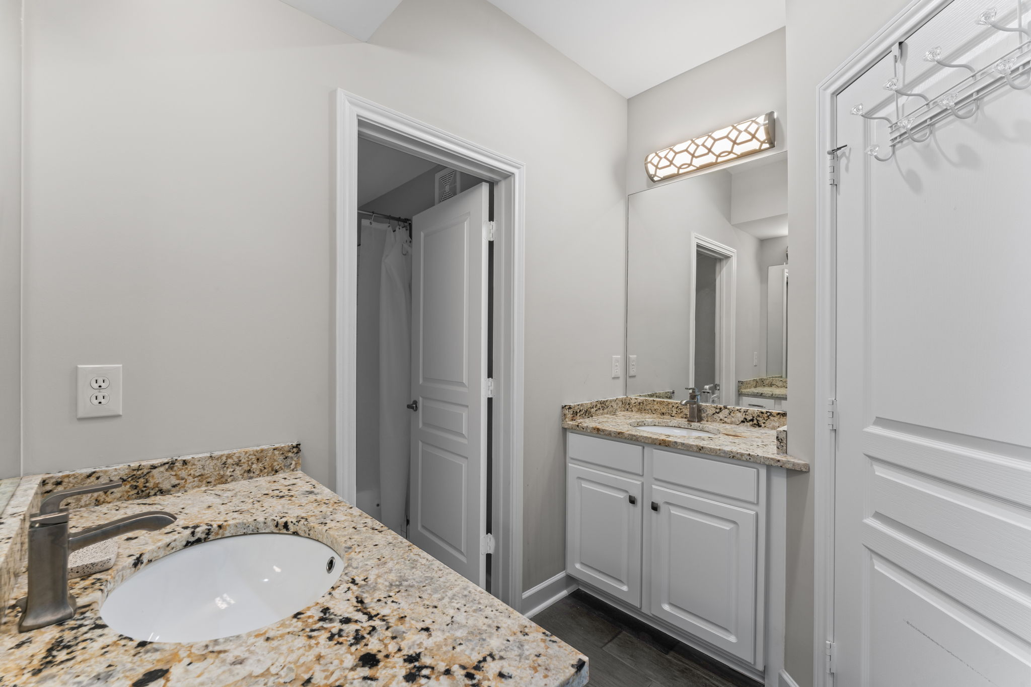 Shared bathroom has separate sinks