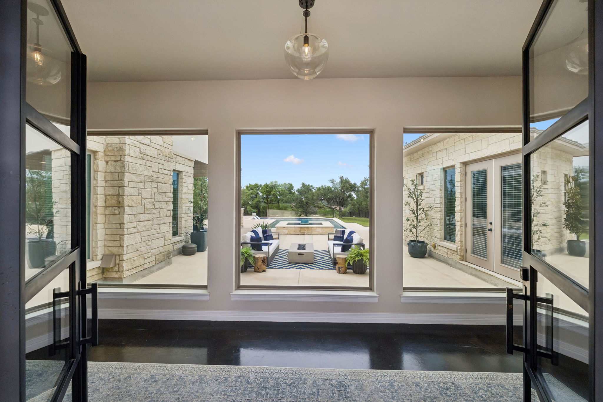 Grand entrance with immediate views of the pool.