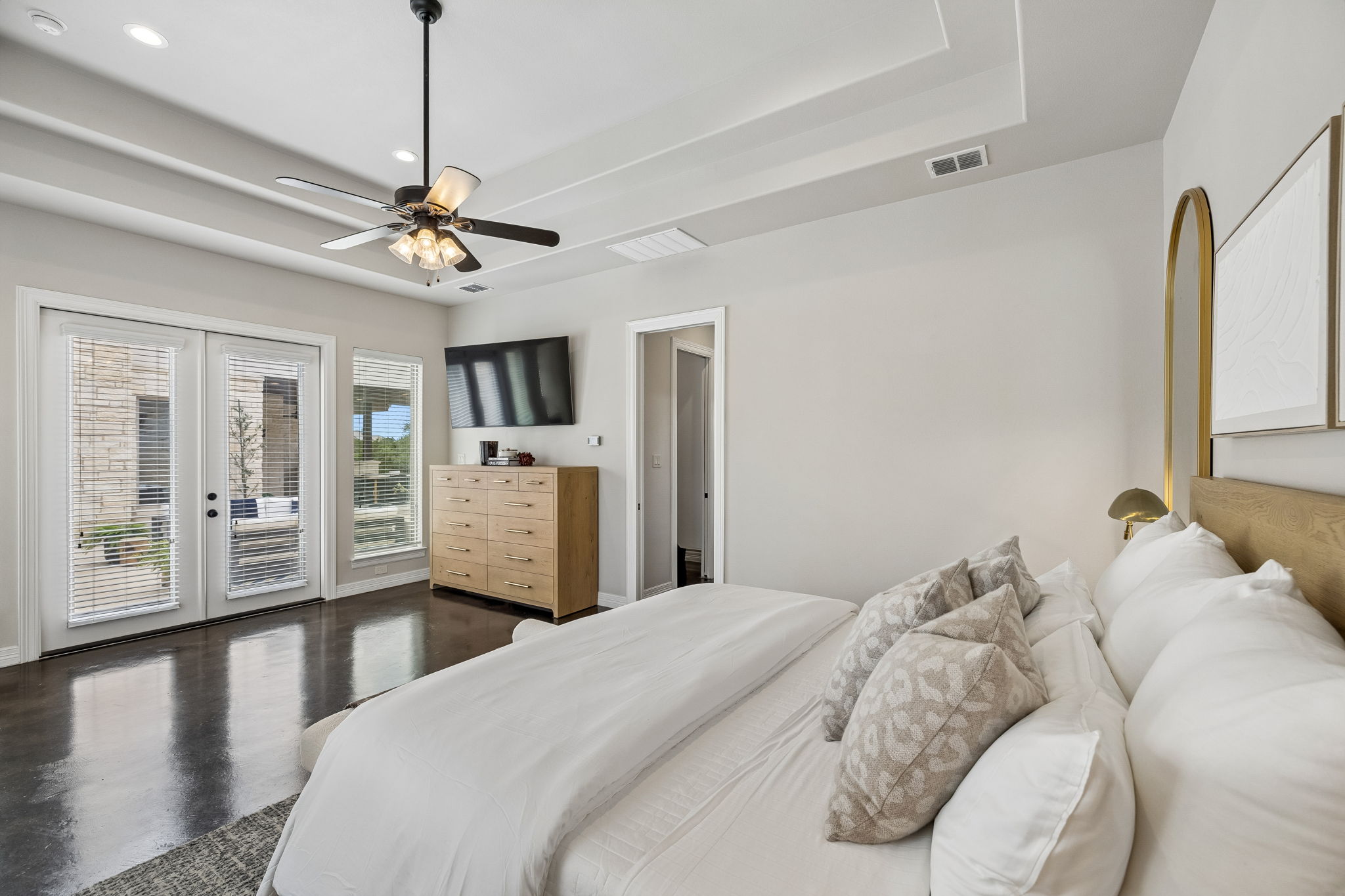 Primary bedroom suite overlooking the pool.