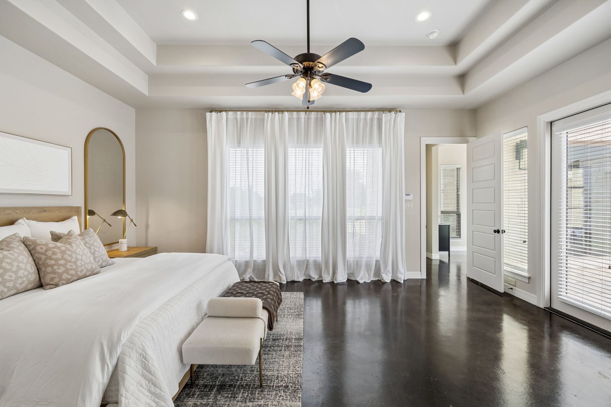 Primary bedroom suite, flooded with natural light.