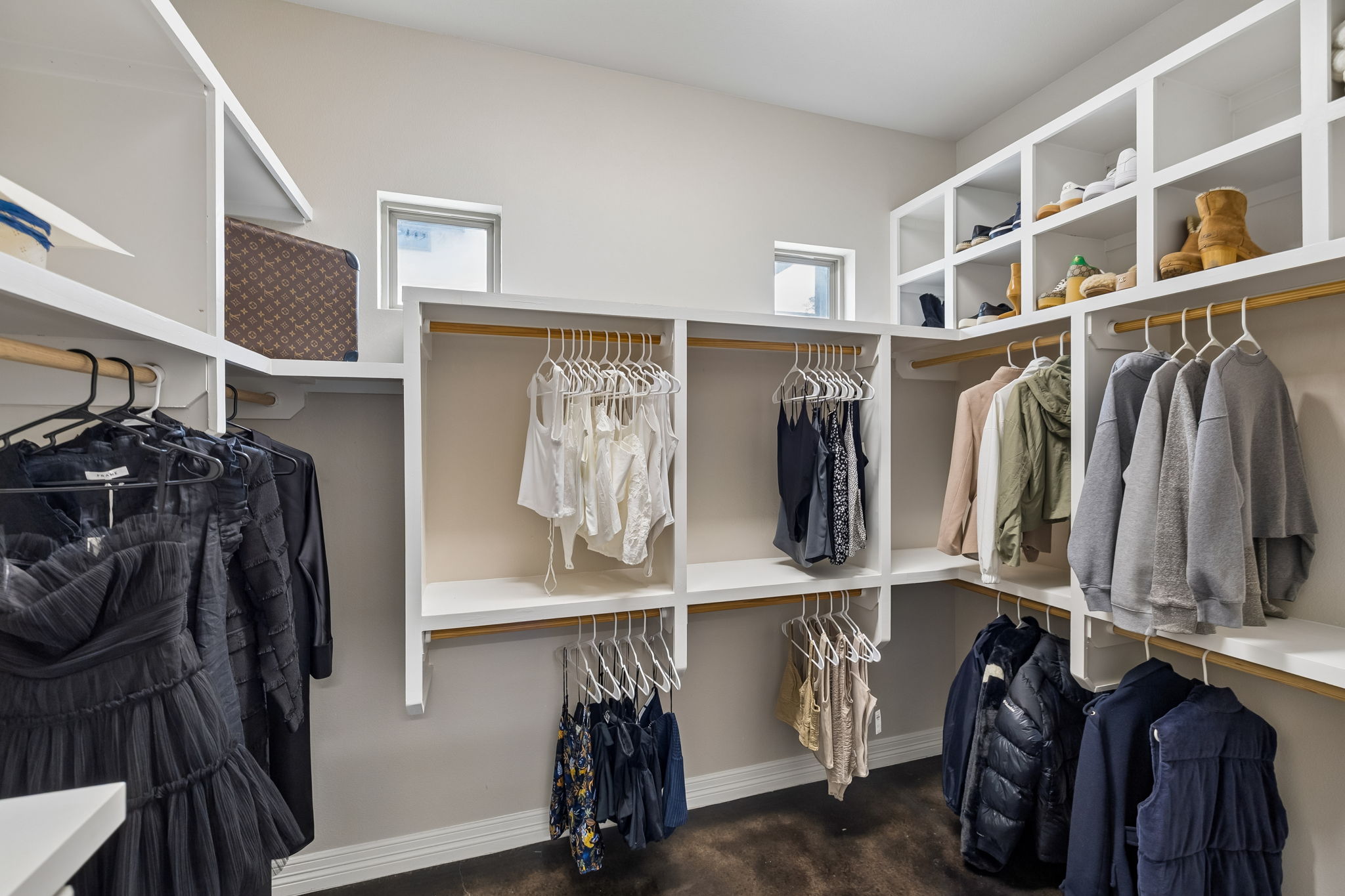 One of two primary walk-in closets for him and her.